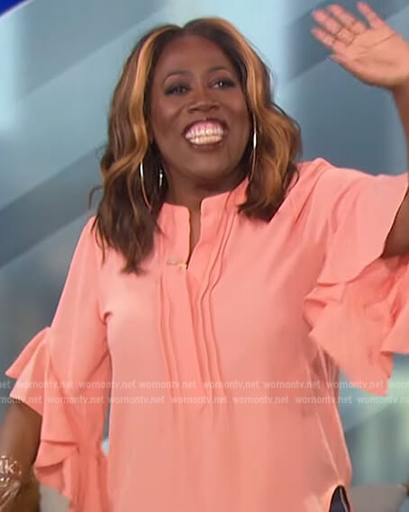 Sheryl’s coral ruffle sleeve blouse on The Talk