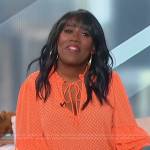 Sheryl’s orange bell sleeve blouse on The Talk