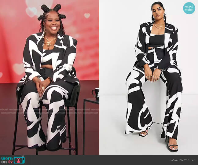 Asos Curve Flared Suit Pants in black & white swirl print worn by Amber Riley on Access Hollywood