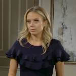 Abby’s navy ruffled dress on The Young and the Restless