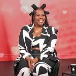 Amber Riley’s black and white printed blazer and pants on Access Hollywood