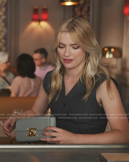 Camille’s leather shoulder bag with chain strap on Emily in Paris