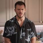 Connor’s black floral print shirt on Home Economics