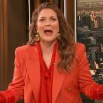 Drew’s orange blazer and tie neck blouse on The Drew Barrymore Show