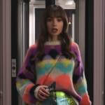 Emily’s colorful sweater and metallic zip front skirt on Emily in Paris Season 3