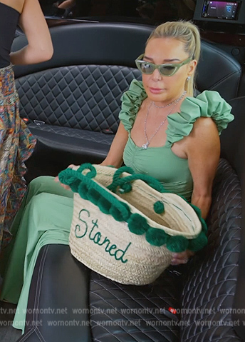 Marysol’s green ruffle shoulder dress on The Real Housewives of Miami