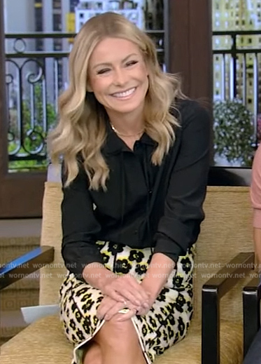 Kelly's black tie neck blouse and floral skirt on Live with Kelly and Ryan