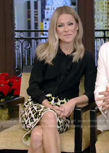 Kelly’s black tie neck blouse and floral skirt on Live with Kelly and Ryan