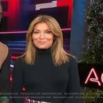 Kit’s black sweater and plaid mini skirt on Access Hollywood