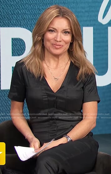 Kits’s black satin jumpsuit on Access Hollywood