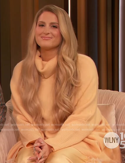 Meghan Trainor’s orange turtleneck sweater on The Drew Barrymore Show