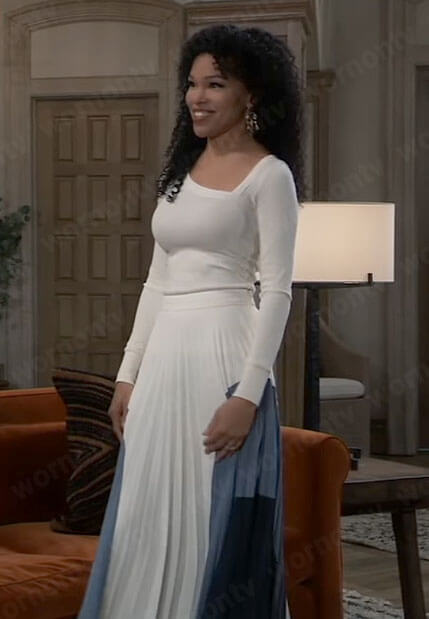 Portia’s white asymmetric sweater and colorblock pleated skirt on General Hospital
