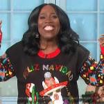 Sheryl’s black embellished Christmas sweater on The Talk