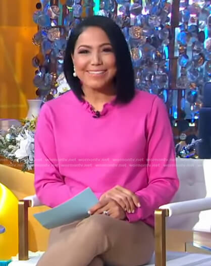 Stephanie’s pink frilled neck top and earrings on Good Morning America