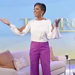 Tamron’s white split sleeve blouse and lace pants on Tamron Hall Show