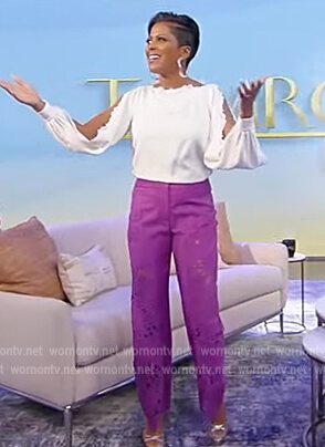 Tamron’s white split sleeve blouse and lace pants on Tamron Hall Show