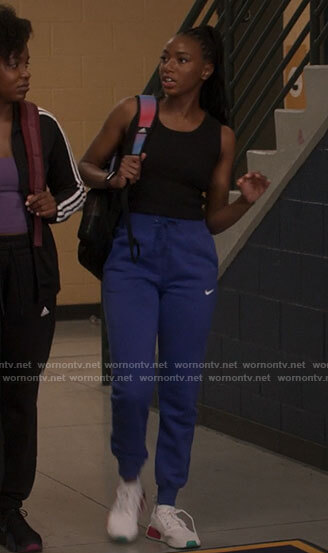 Whitney's blue Nike sweatpants on The Sex Lives of College Girls