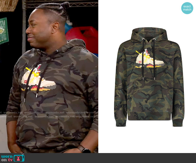 8-Bit by Mostly Heard Rarely Seen Camo Sneaker Graphic Hoodie worn by Marty (Marcel Spears) on The Neighborhood