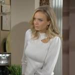 Abby’s white cutout sweater and pink snake print jeans on The Young and the Restless