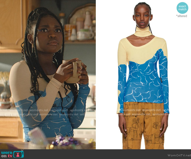 Andersson Bell Yellow Water Wave Turtleneck Top worn by Tasha Rivers (Zuri Reed) on National Treasure: Edge of History