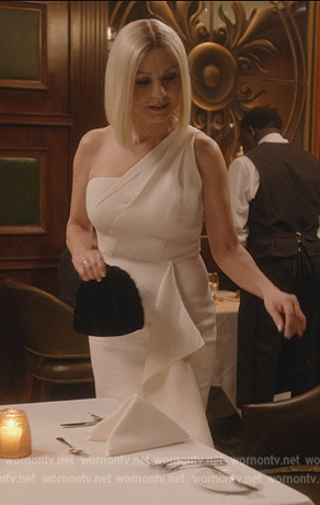 Billie's white one shoulder ruffle dress on National Treasure: Edge of History