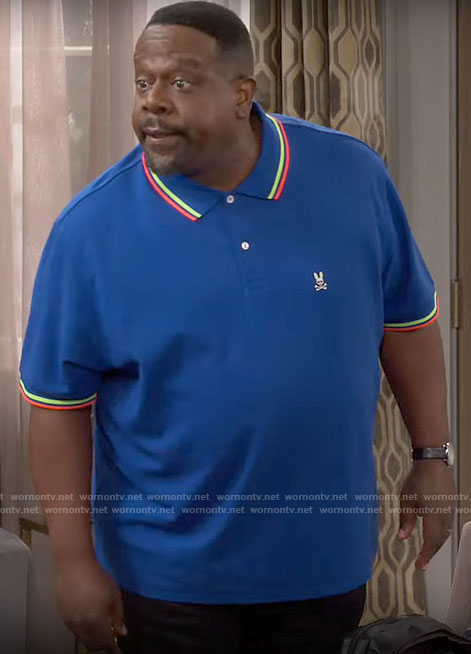 Calvin's blue polo shirt with striped trim on The Neighborhood