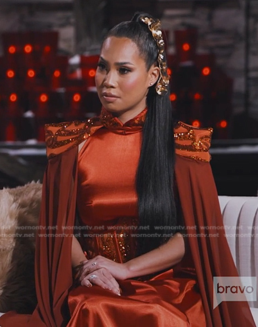 Danna's orange corset jumpsuit with cape on The Real Housewives of Salt Lake City