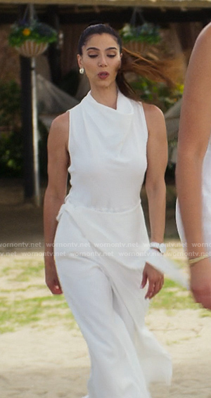Elena’s white cowl neck jumpsuit on Fantasy Island