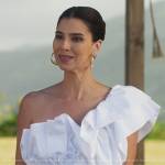 Elena’s white ruffled one-shoulder top on Fantasy Island