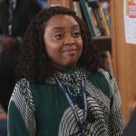 Janine’s green pleated tie neck dress on Abbott Elementary