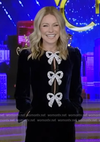 Kelly’s blue velvet bow embellished jumpsuit on Live with Kelly and Ryan