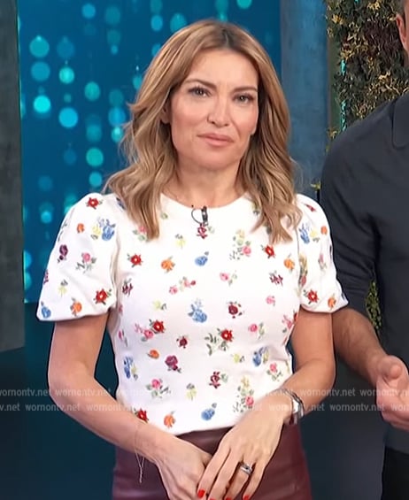 Kit’s white floral print puff sleeve top on Access Hollywood