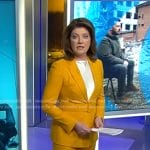 Norah’s yellow belted suit on CBS Evening News