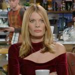 Phyllis’s red velvet dress with asymmetric cutout neckline on The Young and the Restless