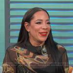 Selenis Leyva’s black printed top and check pants on Access Hollywood