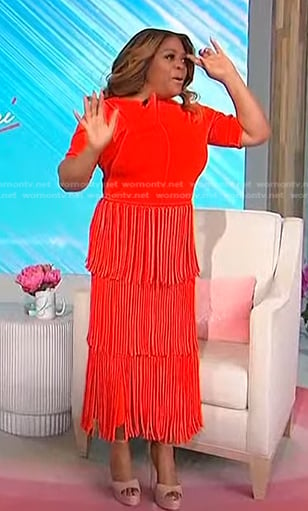 Sherri’s orange top and fringed skirt on Sherri