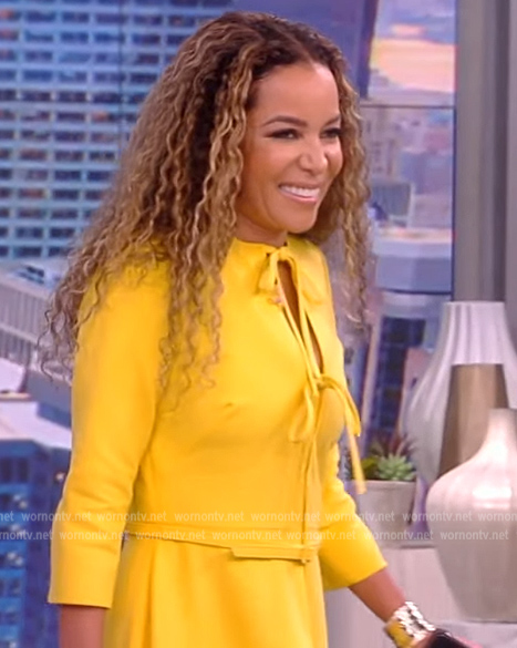Sunny’s yellow bow tie belted dress on The View