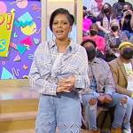 Tamron’s blue plaid shirt and eyelet jeans on Tamron Hall Show