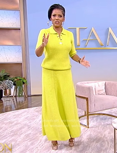 Tamron’s yellow knit polo shirt and skirt on Tamron Hall Show