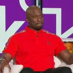 Akbar’s red polo shirt on The Talk