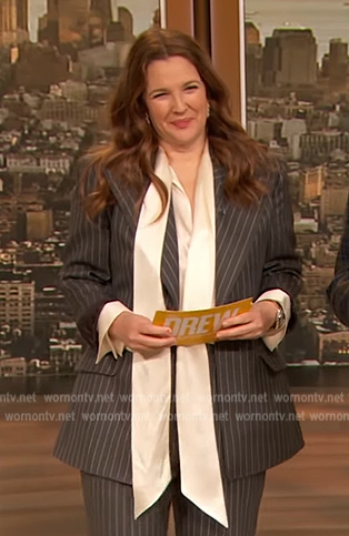 Drew’s white pussy bow blouse and gray blazer on The Drew Barrymore Show