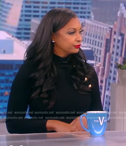 Eboni K. Williams’ black button shoulder dress on The View