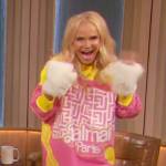 Kristin Chenoweth’s pink Balmain monogram sweater dress on The Drew Barrymore Show