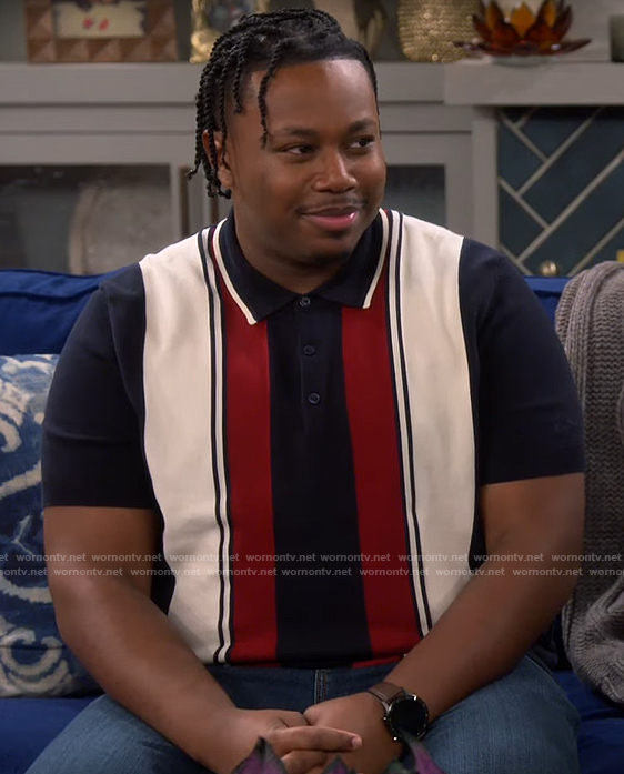 Marty’s navy and red striped polo shirt on The Neighborhood
