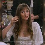 Meredith’s white knit corset top and suede skirt on How I Met Your Father