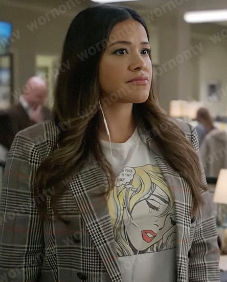 Nell’s graphic tee and grey plaid blazer on Not Dead Yet