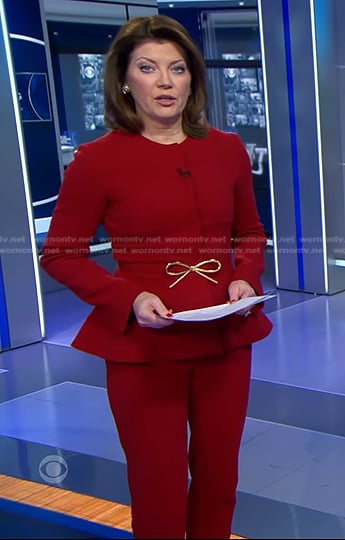 Norah's red peplum jacket and pants on CBS Evening News