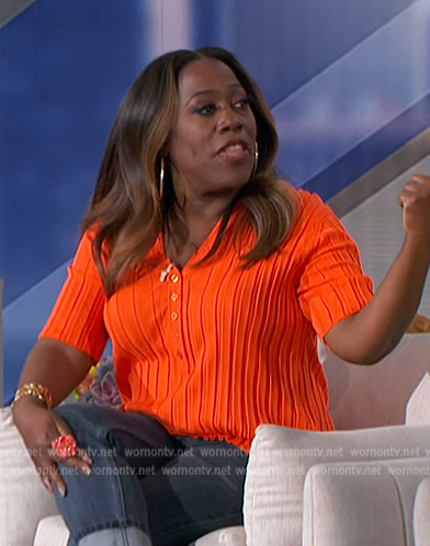 Sheryl's orange ribbed polo top on The Talk