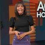 Zuri’s purple tweed skirt and black puff sleeve top on Access Hollywood