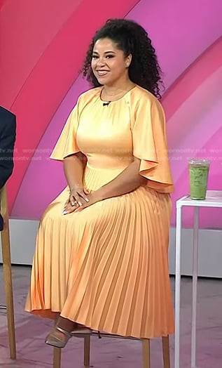 Arianna Davis’s orange pleated dress on Today